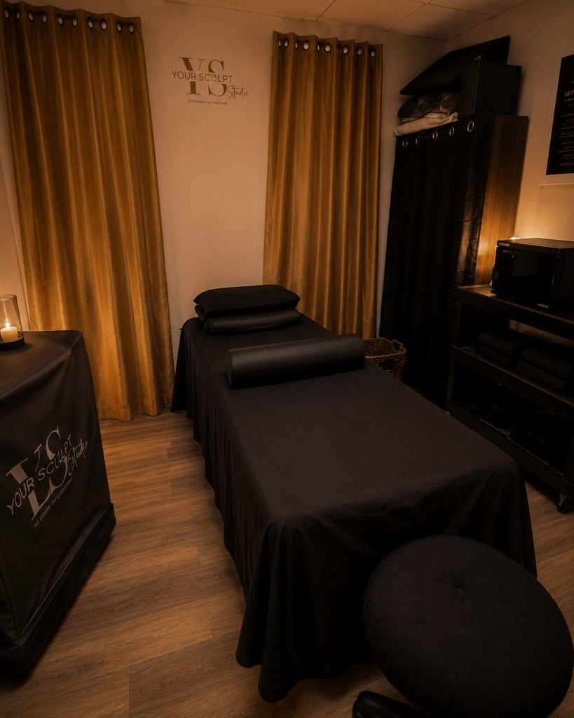 Dimly Lit Spa Room With Massage Table and Golden Curtains