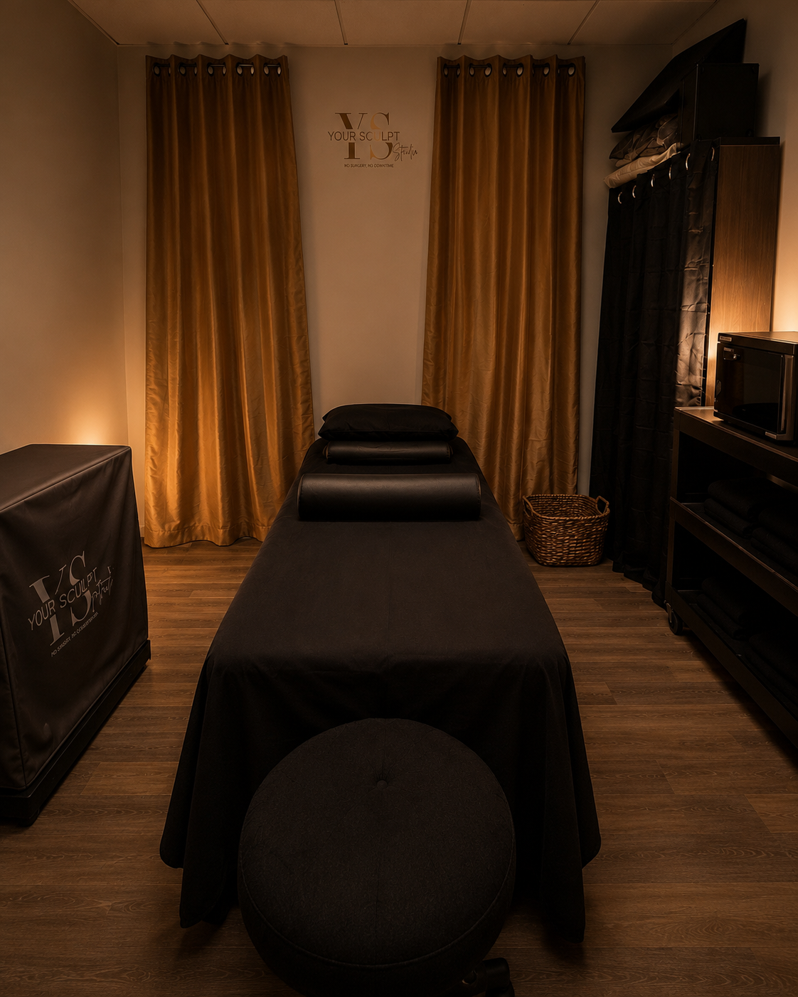 Cozy Treatment Room with Massage Table and Golden Curtains for Skin Tightening